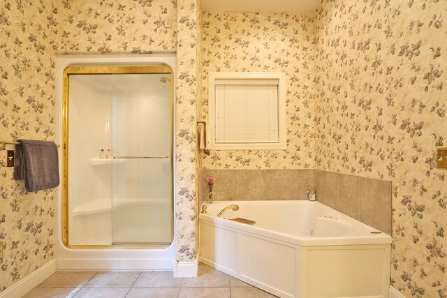 607 Sumac Ln, Marshfield, MO 65706 - bathroom featuring wallpapered walls, baseboards, a garden tub, tile patterned floors, and a stall shower
