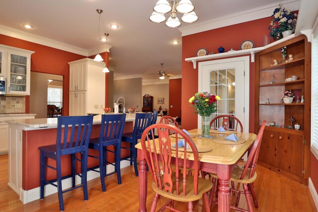 607 Sumac Ln, Marshfield, MO 65706 - dining area with ornamental molding, light wood finished floors, a chandelier, recessed lighting, and a ceiling fan