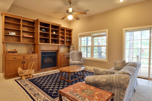 607 Sumac Ln, Marshfield, MO 65706 - living area with ceiling fan, baseboards, a glass covered fireplace, recessed lighting, and light colored carpet