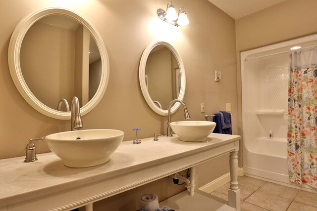 607 Sumac Ln, Marshfield, MO 65706 - full bath featuring tile patterned flooring, double vanity, shower / bath combination with curtain, and baseboards
