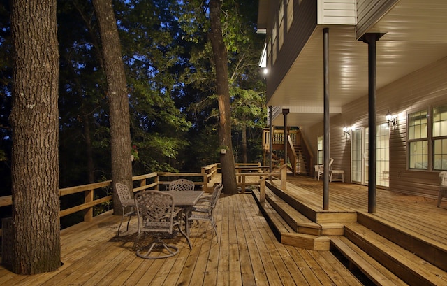 607 Sumac Ln, Marshfield, MO 65706 - deck at twilight with outdoor dining area and stairway