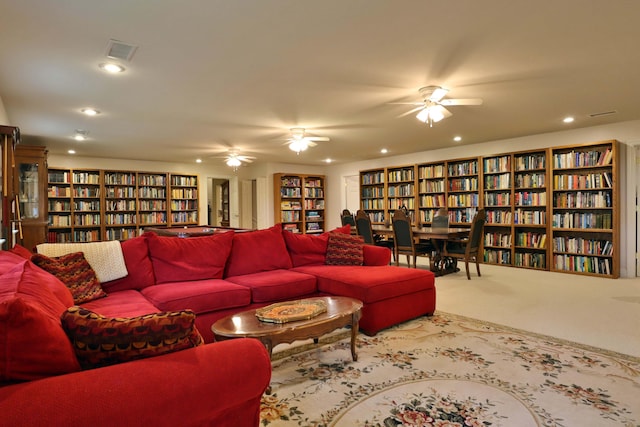 607 Sumac Ln, Marshfield, MO 65706 - living area featuring bookshelves, carpet floors, and recessed lighting