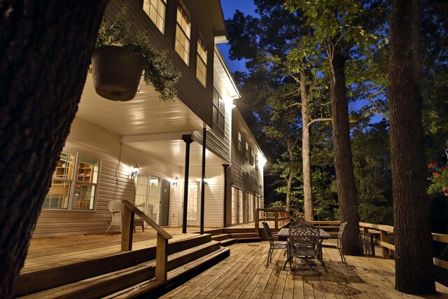 607 Sumac Ln, Marshfield, MO 65706 - deck at twilight featuring outdoor dining area