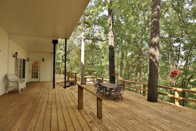 607 Sumac Ln, Marshfield, MO 65706 - wooden terrace with outdoor dining area and view of wooded area