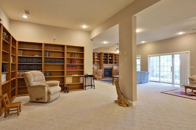 607 Sumac Ln, Marshfield, MO 65706 - living area with carpet floors, a glass covered fireplace, ceiling fan, and recessed lighting