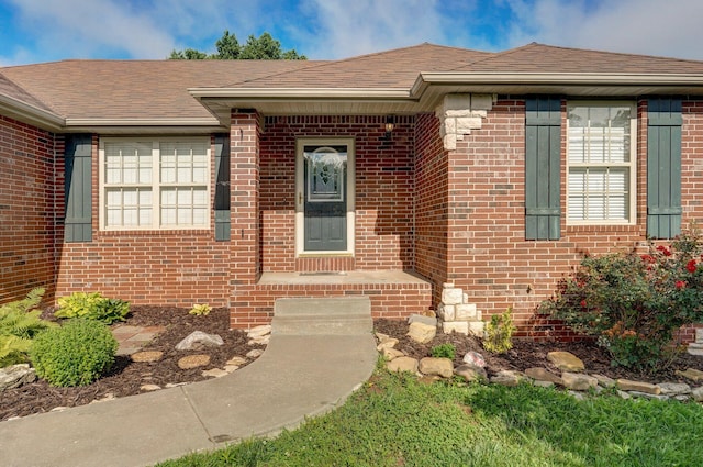 259 Aven Ave, Sparta, MO 65753 - view of exterior entry with brick siding and a shingled roof