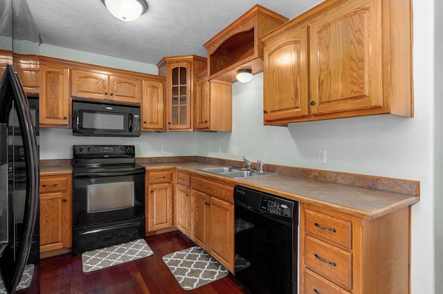259 Aven Ave, Sparta, MO 65753 - kitchen with black appliances, dark wood-type flooring, glass insert cabinets, a textured ceiling, and brown cabinets