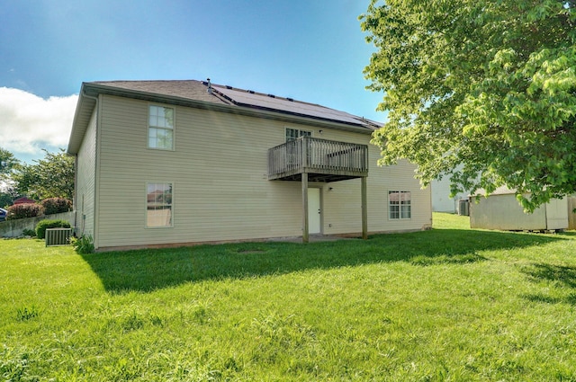 259 Aven Ave, Sparta, MO 65753 - back of property with a yard and a wooden deck