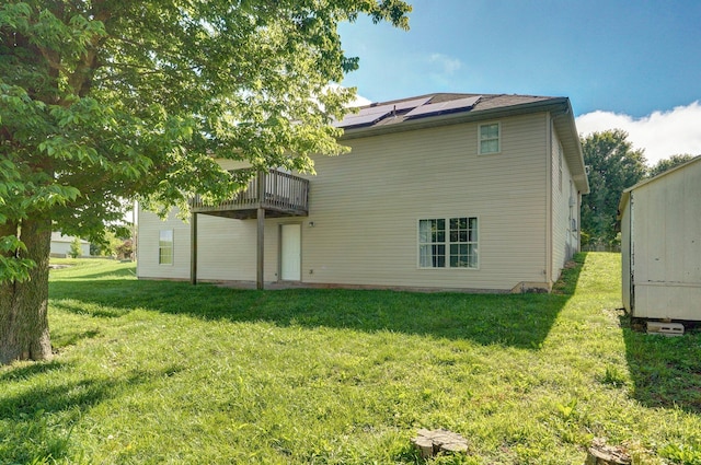 259 Aven Ave, Sparta, MO 65753 - back of house with solar panels and a yard