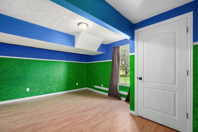 259 Aven Ave, Sparta, MO 65753 - unfurnished room with wood finished floors and a textured ceiling