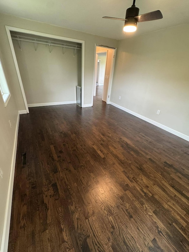 8574 County Road 6890, West Plains, MO 65775 - unfurnished bedroom with dark wood-style floors, a closet, baseboards, and a ceiling fan