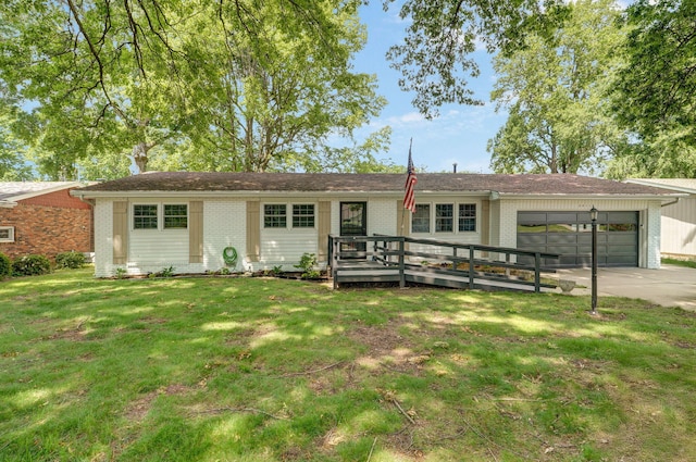 2411 S Rogers Ave, Springfield, MO 65804 - single story home with an attached garage, brick siding, driveway, a front lawn, and a deck