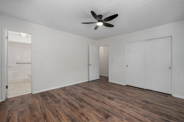 2411 S Rogers Ave, Springfield, MO 65804 - unfurnished bedroom with wood finished floors, ensuite bath, a closet, and baseboards