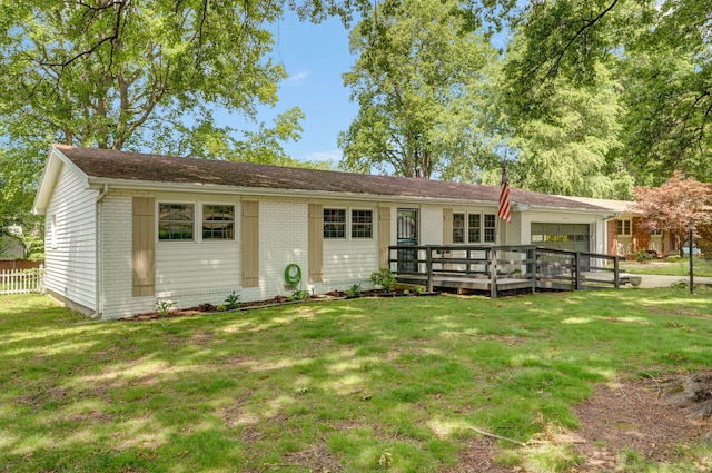 2411 S Rogers Ave, Springfield, MO 65804 - single story home featuring brick siding, a front lawn, a deck, and a garage