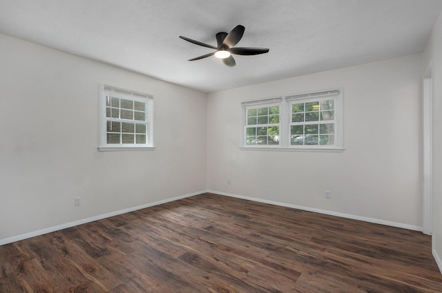 2411 S Rogers Ave, Springfield, MO 65804 - empty room featuring a ceiling fan, dark wood-style flooring, and baseboards