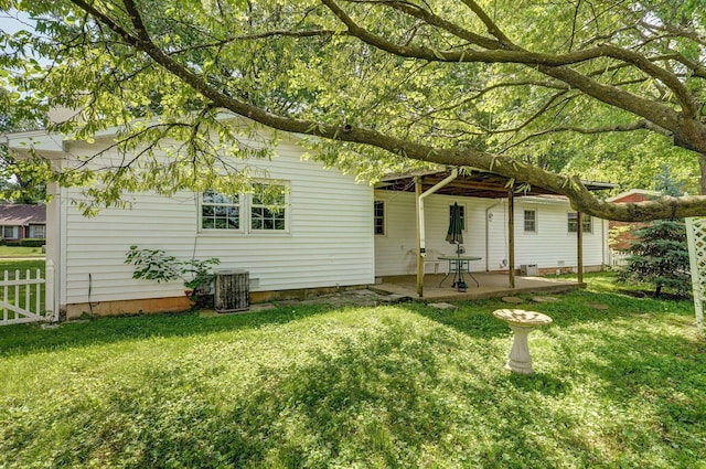 2411 S Rogers Ave, Springfield, MO 65804 - rear view of property featuring central AC and a patio