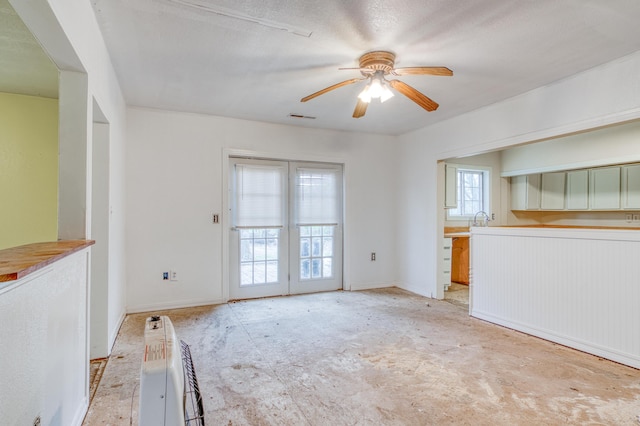 21461 Needles Eye Rd, Shell Knob, MO 65747 - unfurnished living room with ceiling fan, a sink, and baseboards