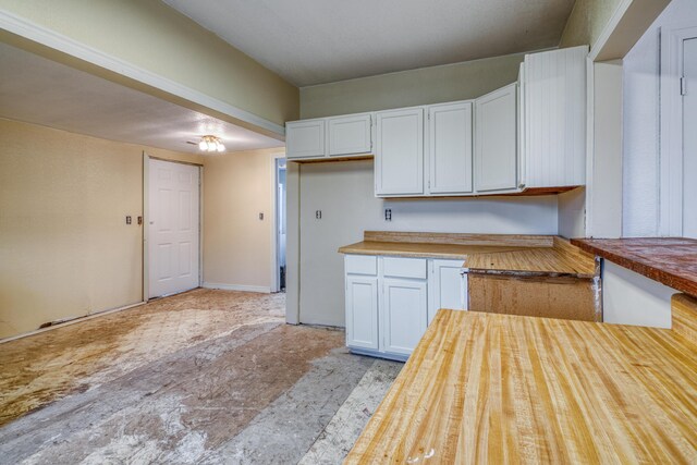 21461 Needles Eye Rd, Shell Knob, MO 65747 - kitchen with wood counters and white cabinets