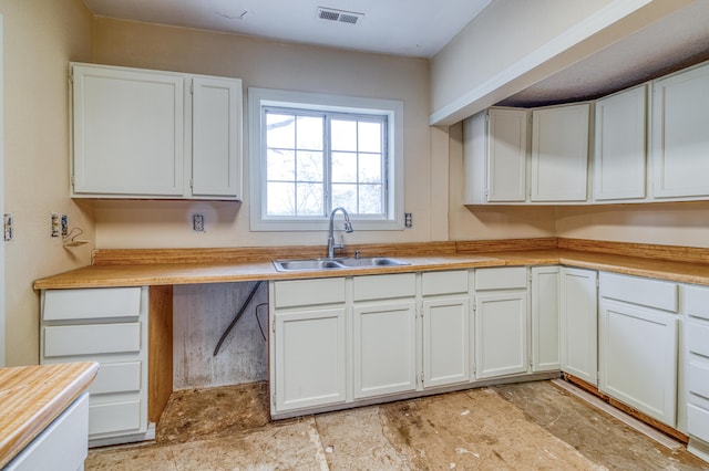21461 Needles Eye Rd, Shell Knob, MO 65747 - kitchen featuring a sink, white cabinets, and light countertops