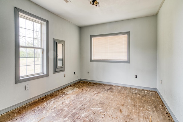 21461 Needles Eye Rd, Shell Knob, MO 65747 - spare room featuring baseboards and wood-type flooring