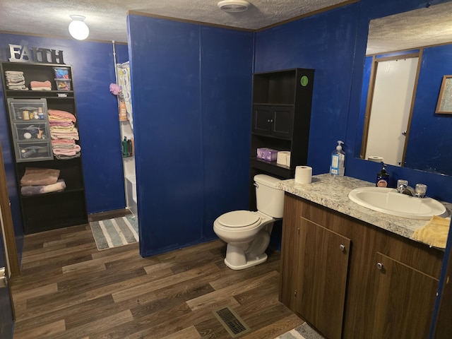 285 Lace Loop, Conway, MO 65632 - bathroom with a textured ceiling, vanity, wood finished floors, toilet, and shower / bath combo