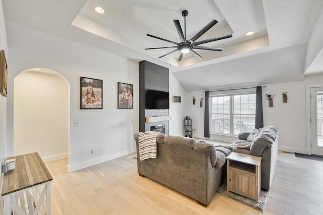 317 Cinnamon Ct, Sparta, MO 65753 - living area with a raised ceiling, a large fireplace, light wood-style floors, a ceiling fan, and recessed lighting