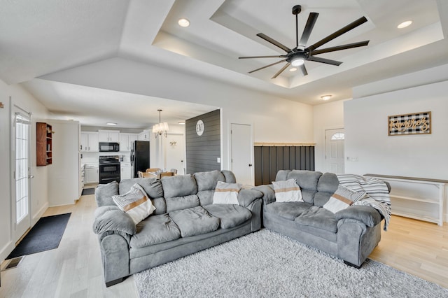 317 Cinnamon Ct, Sparta, MO 65753 - living room with a tray ceiling, a ceiling fan, light wood-type flooring, and recessed lighting