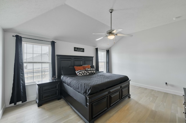 317 Cinnamon Ct, Sparta, MO 65753 - bedroom with vaulted ceiling, multiple windows, light wood-style floors, and baseboards