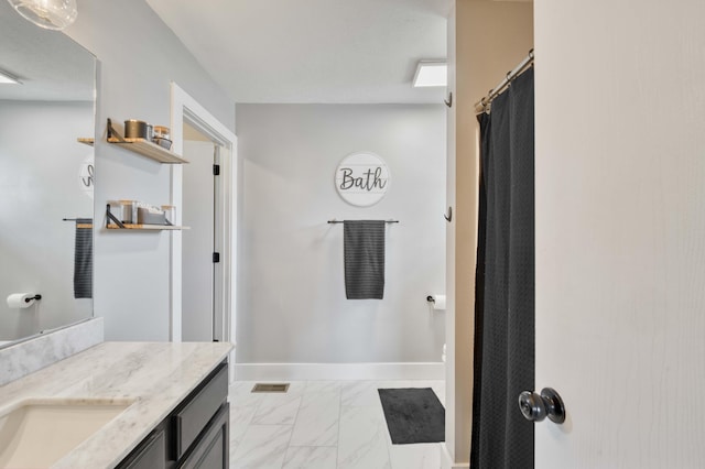 317 Cinnamon Ct, Sparta, MO 65753 - full bathroom with marble look tile flooring, vanity, and baseboards