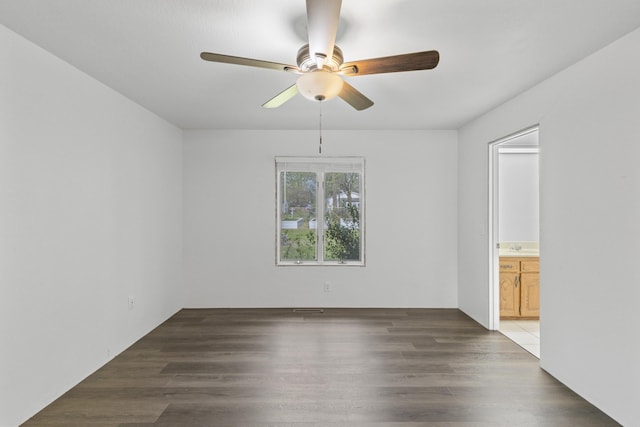 824 Highland Dr, Aurora, MO 65605 - empty room with ceiling fan and wood finished floors