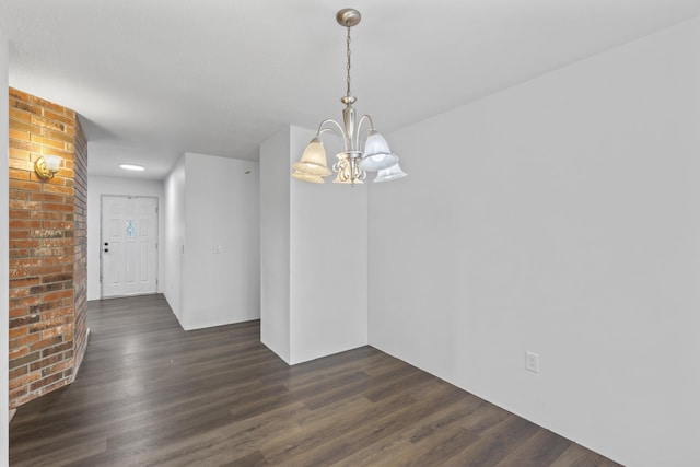 824 Highland Dr, Aurora, MO 65605 - unfurnished dining area featuring a chandelier and dark wood-style flooring