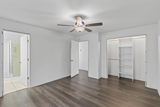 824 Highland Dr, Aurora, MO 65605 - unfurnished bedroom with dark wood finished floors, connected bathroom, a ceiling fan, and a closet