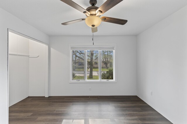 824 Highland Dr, Aurora, MO 65605 - unfurnished bedroom featuring a closet, wood finished floors, and a ceiling fan