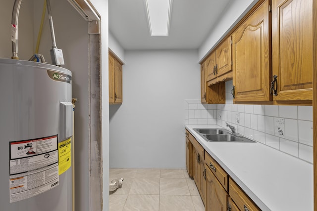 824 Highland Dr, Aurora, MO 65605 - kitchen featuring water heater, a sink, backsplash, light countertops, and brown cabinets