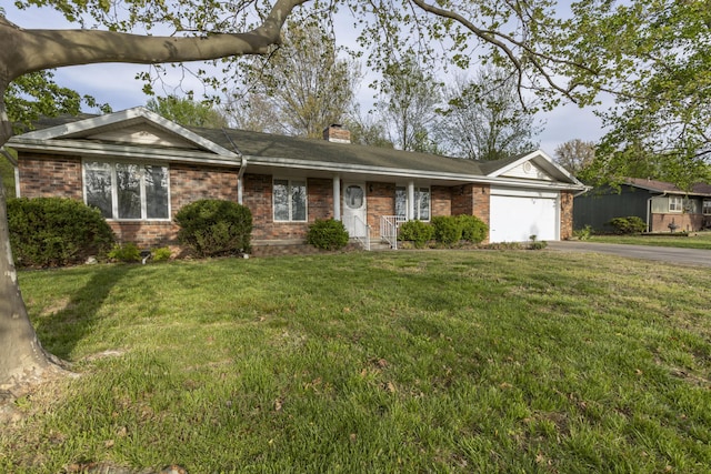 824 Highland Dr, Aurora, MO 65605 - single story home featuring asphalt driveway, brick siding, an attached garage, a chimney, and a front yard