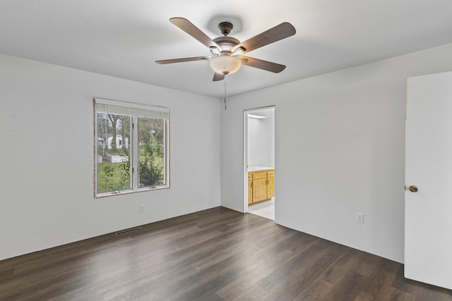 824 Highland Dr, Aurora, MO 65605 - empty room featuring dark wood-style flooring and a ceiling fan