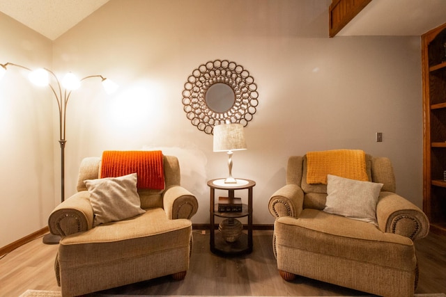 1831 E Woodbine St, Springfield, MO 65803 - sitting room with wood finished floors, lofted ceiling, and baseboards