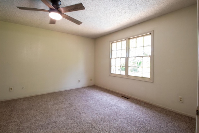 1831 E Woodbine St, Springfield, MO 65803 - unfurnished room featuring carpet, a textured ceiling, and ceiling fan