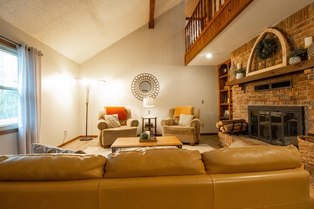 1831 E Woodbine St, Springfield, MO 65803 - living area with baseboards, wood finished floors, plenty of natural light, vaulted ceiling, and a brick fireplace