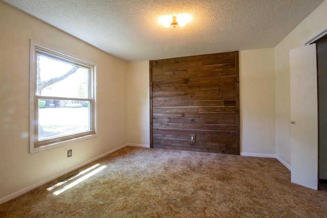 1831 E Woodbine St, Springfield, MO 65803 - unfurnished room featuring a textured ceiling and carpet floors