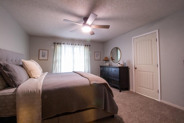 1831 E Woodbine St, Springfield, MO 65803 - carpeted bedroom featuring a ceiling fan, a textured ceiling, and baseboards