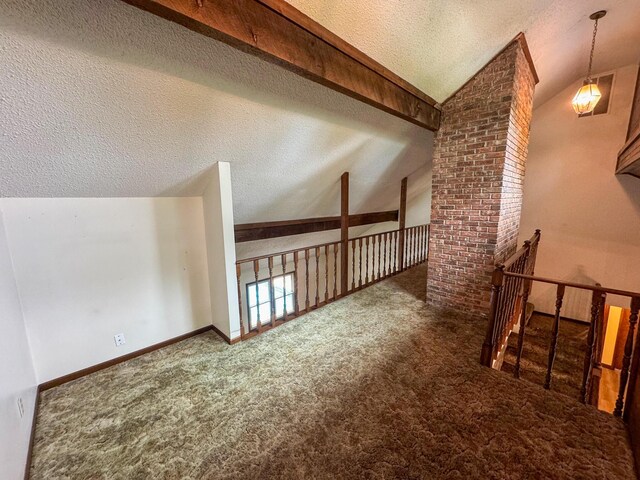 1831 E Woodbine St, Springfield, MO 65803 - additional living space with a textured ceiling, carpet, and lofted ceiling