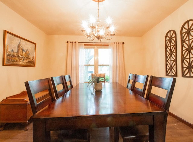 1831 E Woodbine St, Springfield, MO 65803 - dining space with a chandelier, wood finished floors, and baseboards