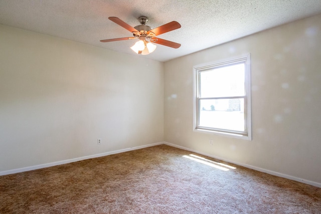 1831 E Woodbine St, Springfield, MO 65803 - carpeted spare room featuring a ceiling fan, baseboards, and a textured ceiling