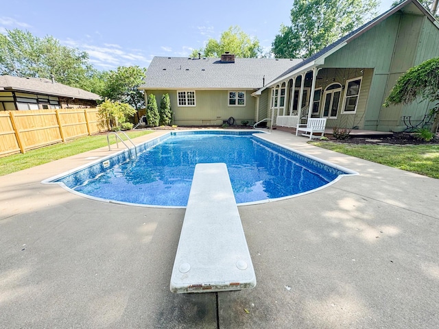 1831 E Woodbine St, Springfield, MO 65803 - view of swimming pool featuring a patio and a diving board
