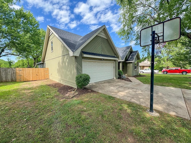 1831 E Woodbine St, Springfield, MO 65803 - view of side of home featuring a garage, a shingled roof, driveway, and brick siding