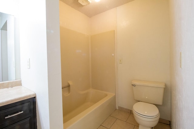 1831 E Woodbine St, Springfield, MO 65803 - bathroom with vanity, toilet, tile patterned flooring, a textured ceiling, and  shower combination