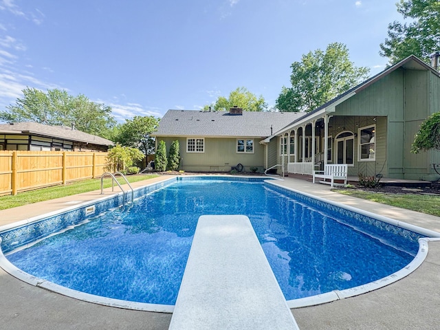 1831 E Woodbine St, Springfield, MO 65803 - view of swimming pool with a diving board and a sunroom