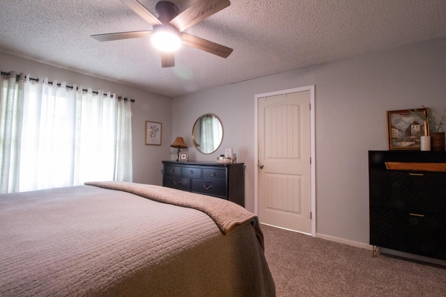 1831 E Woodbine St, Springfield, MO 65803 - carpeted bedroom with a textured ceiling, a ceiling fan, and baseboards