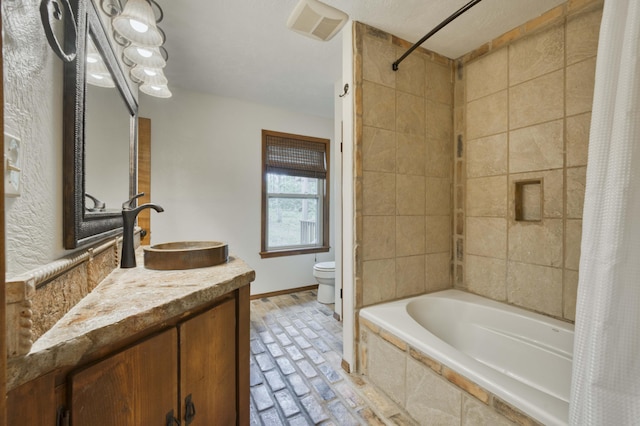 224 Loveland Dr, Rogersville, MO 65742 - full bath with toilet, vanity, tiled shower / bath combo, and baseboards